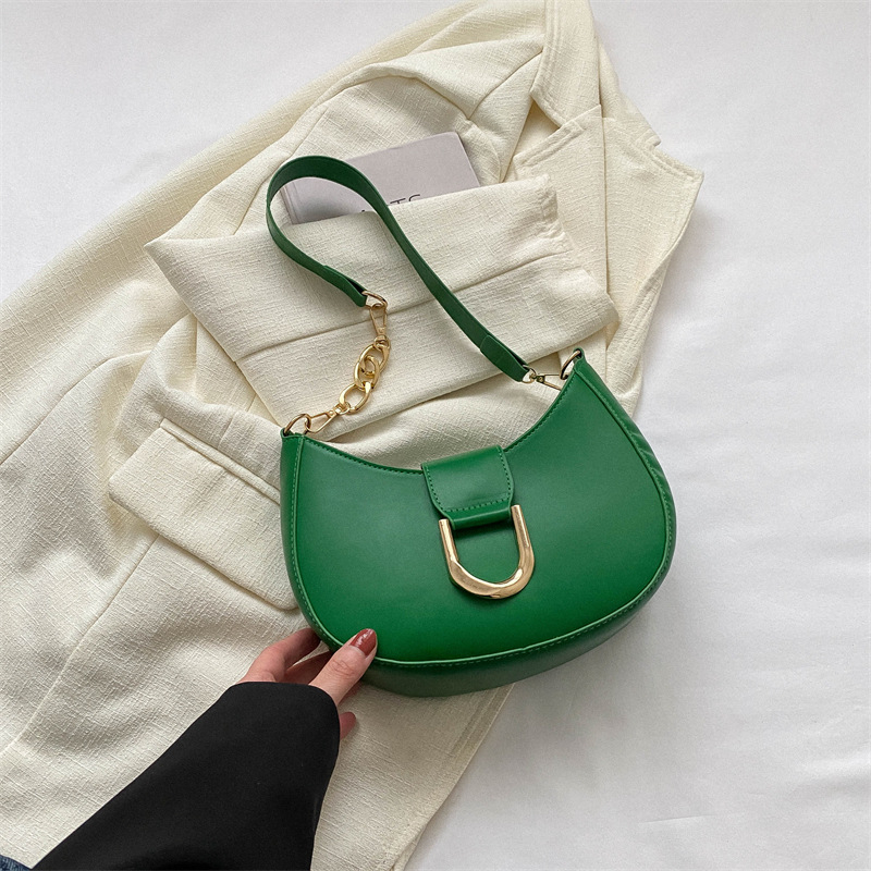 PU anyagú válltáska gombóc alakú dizájnal, poliészter bélés, cipzáras zárás, utcai trend