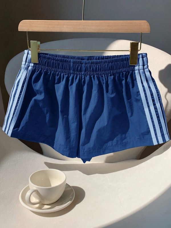 Női lazán szabott sport-casual nadrág, 3/4 hosszú, középmagas derékkal, szövött poliészter anyag 95%+