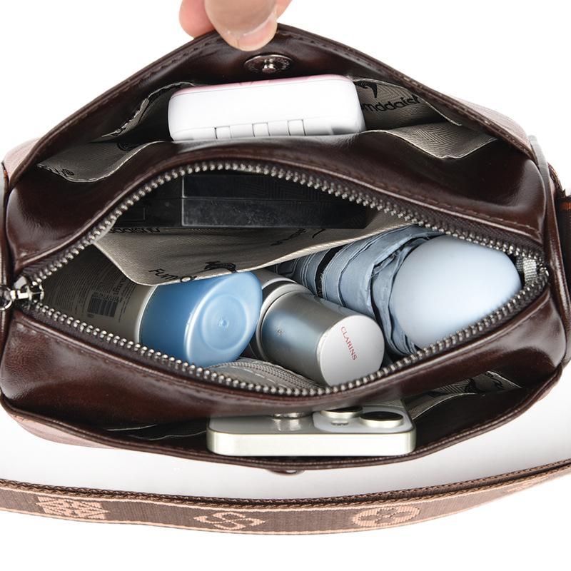 Τσάντα PU bucket bag με κυλινδρικό σχήμα, στυλ αστικής απλότητας, φερμουάρ για το άνοιγμα, εσωτερικό διαμέρισμα με φερμουάρ και θήκη ID