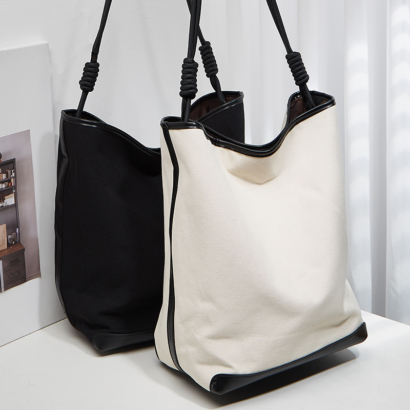 ANNMUU Vászon vödrötáska — városi minimalist stílus, mágneszár, belső cipzáras zseb, telefon- és ID-zseb, függőleges négyszögletű forma