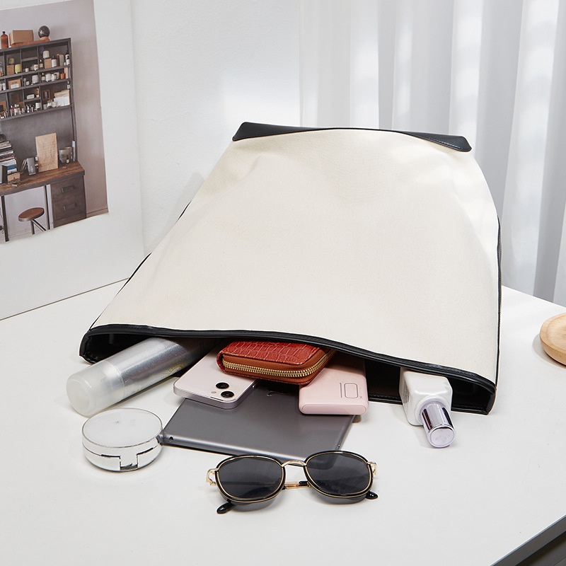 ANNMUU Vászon vödrötáska — városi minimalist stílus, mágneszár, belső cipzáras zseb, telefon- és ID-zseb, függőleges négyszögletű forma