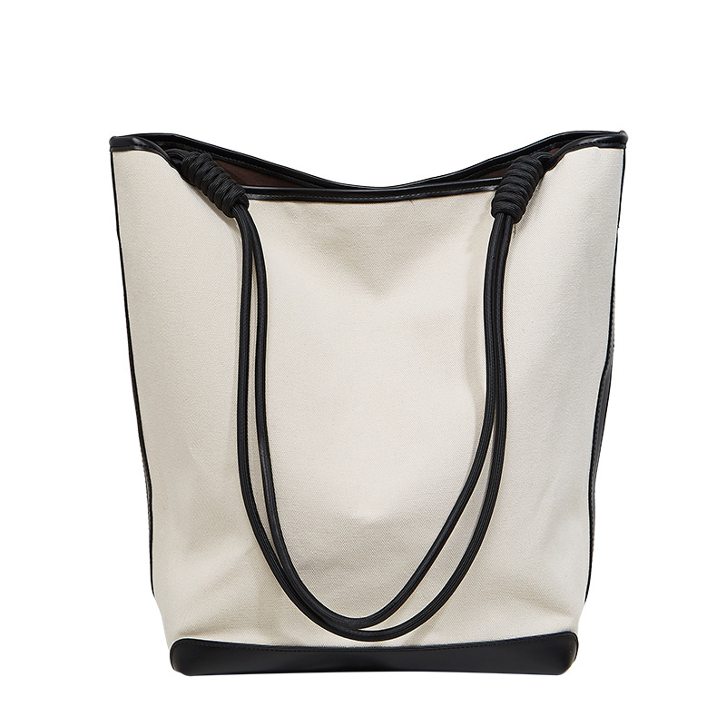 ANNMUU Vászon vödrötáska — városi minimalist stílus, mágneszár, belső cipzáras zseb, telefon- és ID-zseb, függőleges négyszögletű forma