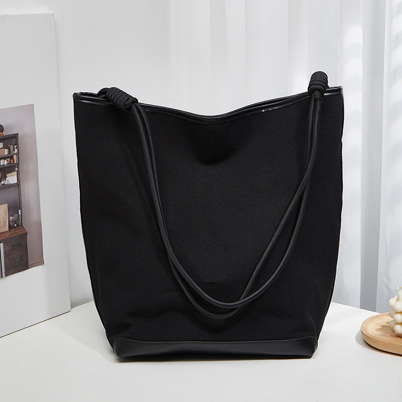 ANNMUU Vászon vödrötáska — városi minimalist stílus, mágneszár, belső cipzáras zseb, telefon- és ID-zseb, függőleges négyszögletű forma