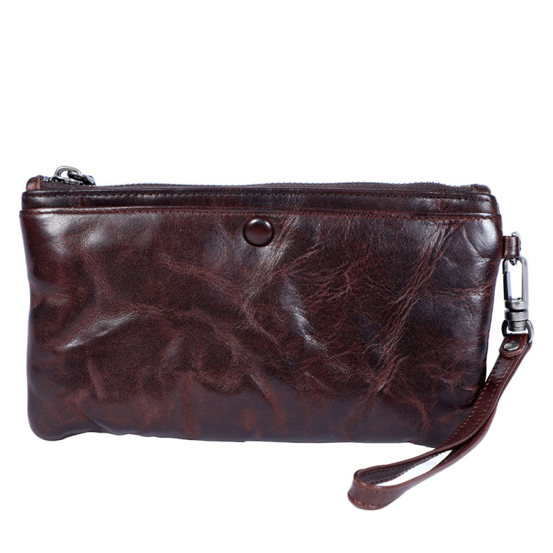 Vīriešu klutch maciņš no augstākās kvalitātes ādas – augšējā slāņa liellā āda; horizontāla kvadrāta forma; rāvējslēdzējs; iekšējā organizācija: tālruņa kabata, ID kabata, kartes kabatas, banknošu kabata