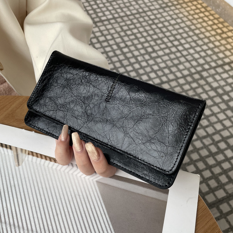 Női hosszú valódi bőrtáska, sokoldalú 2025-ös modell, ultra vékony bőr, kártyatartó, kompakt elegáns csat