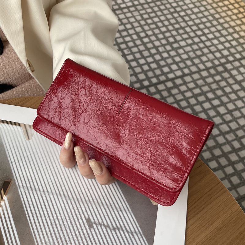 Női hosszú valódi bőrtáska, sokoldalú 2025-ös modell, ultra vékony bőr, kártyatartó, kompakt elegáns csat