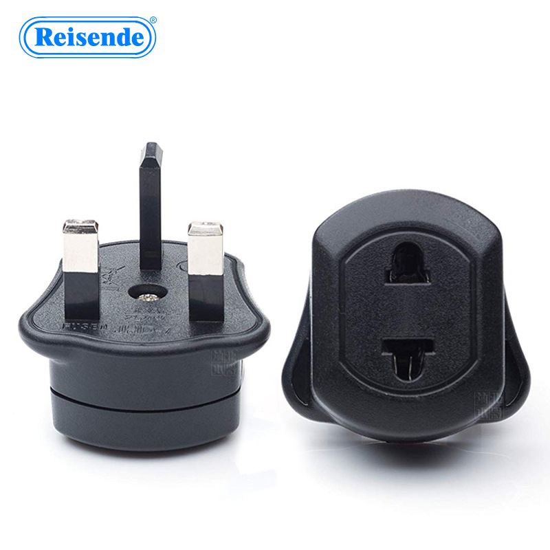 Reisende kelioninis kištukų adapteris iš UK į EU/US su saugikliu