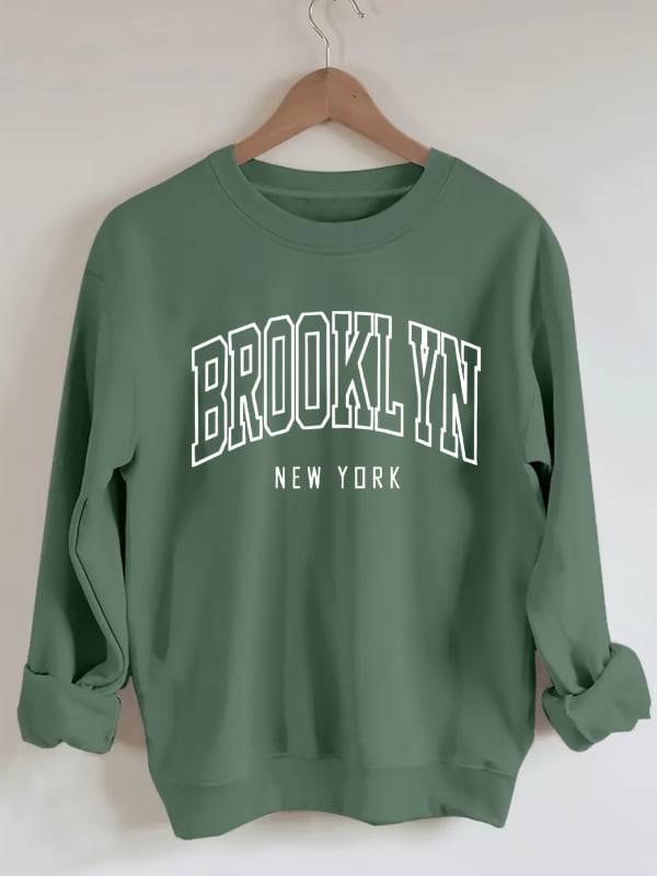 Brooklyn betűk pulóver, laza lányos stílus, poliészter 95%+, betűs minta, kerek nyakú, rövid ujjú