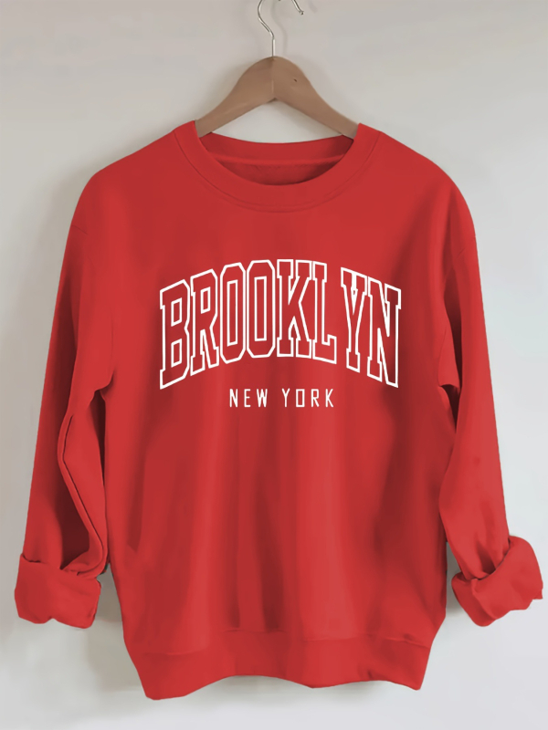 Brooklyn betűk pulóver, laza lányos stílus, poliészter 95%+, betűs minta, kerek nyakú, rövid ujjú