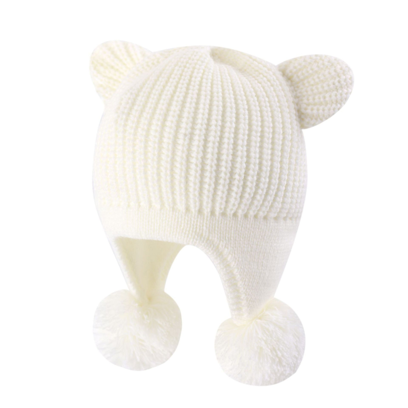 Cepure ar lāča ausīm un dubultām pūciņām — silta un vēja izturīga, akrils