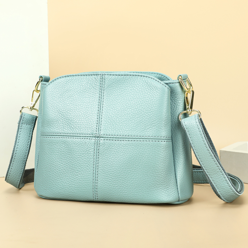 Női oldaltáska valódi bőrből, első réteg marhabőrből, bucket stílus, vízszintes négyzet alak, cipzáras zárás