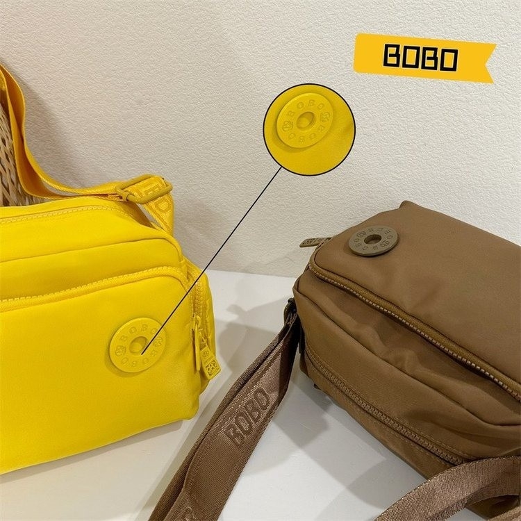 Bou bou vállon átvet táska, Oxford anyag, horizontális négyzet alak, cipzáras záródás, belső zsebek telefon és személyi igazolvány számára