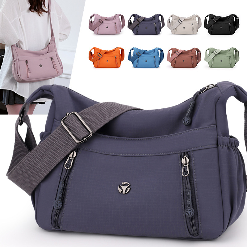 Mu Lan Fox Crossbody táska – Nylon, városi minimalizmus, horizontális négyzet alakú forma, cipzáras záródás, belső zsebek