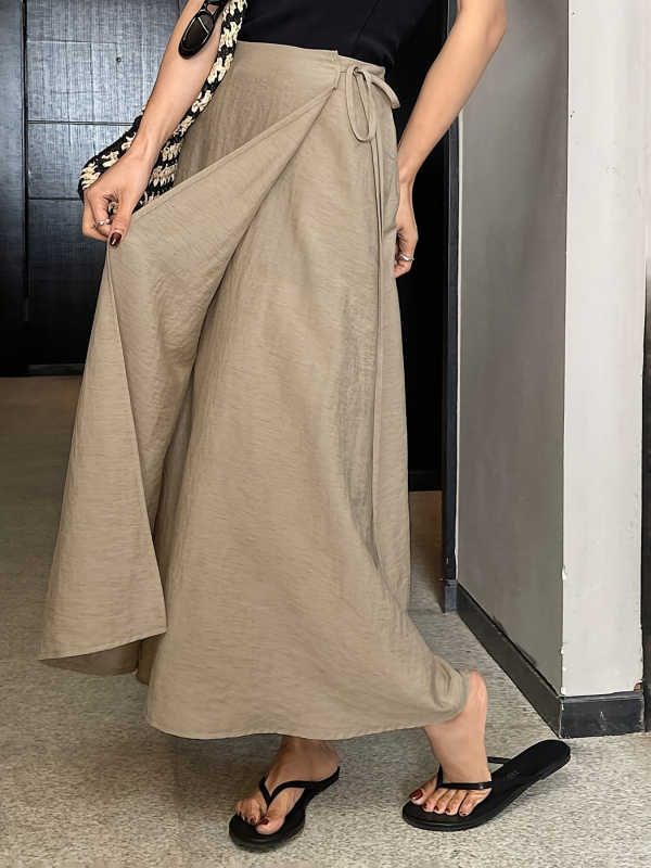 Ženska asimetrična suknja, srednja duljina, poliestersko-elastan materijal, elegantan svakodnevni stil, ljeto 2025 (90-95% poliestera; <30% elastan)