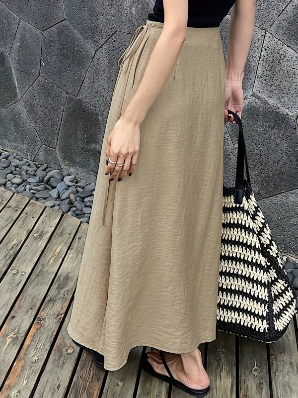 Ženska asimetrična suknja, srednja duljina, poliestersko-elastan materijal, elegantan svakodnevni stil, ljeto 2025 (90-95% poliestera; <30% elastan)