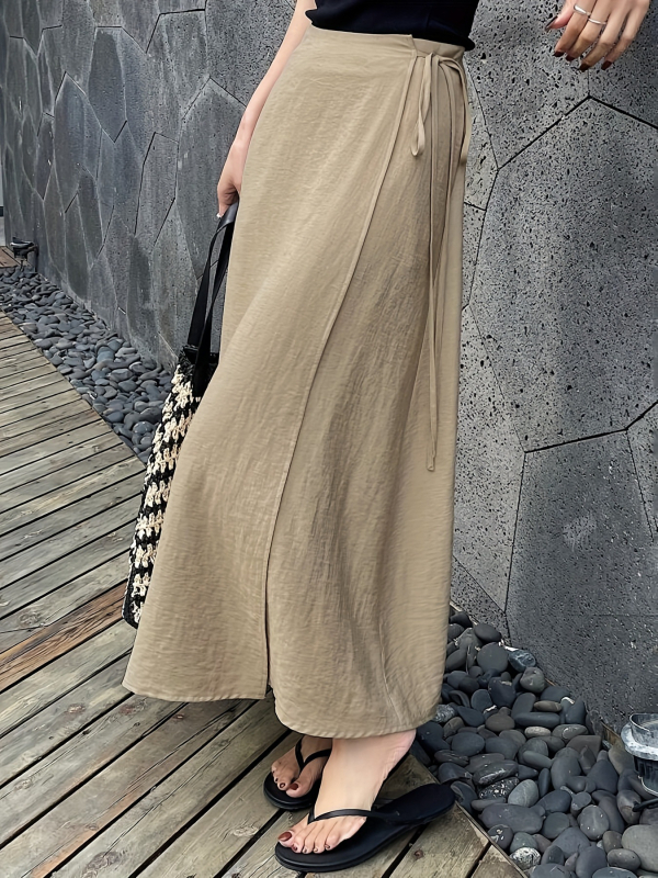 Ženska asimetrična suknja, srednja duljina, poliestersko-elastan materijal, elegantan svakodnevni stil, ljeto 2025 (90-95% poliestera; <30% elastan)