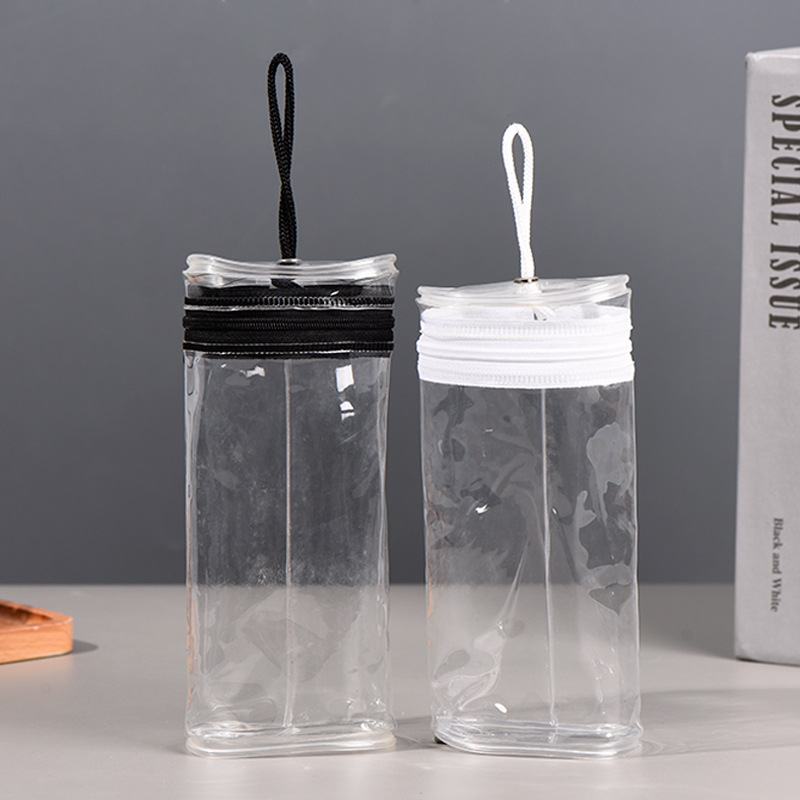 Skaidrus PVC pakavimo maišelis su apvalia cilindrine forma ir užtrauktuku, skirtas žymekliams ir pieštukams