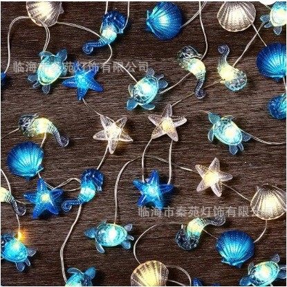 LED varinės vielos žibintų girlianda — Vandenyno serija su kriauklėmis ir jūros arkliuku dekoracijoms kieme ar patalpoje; 20 LED, 2700K, 5000 lm, IP42, baterijų dėžutė