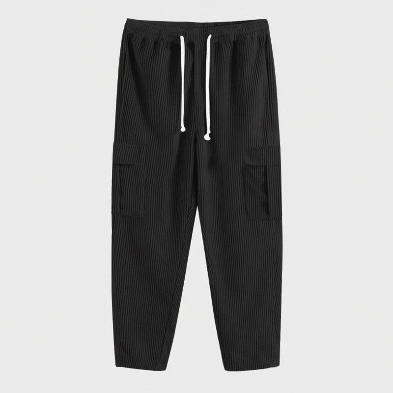 Kényelmes kordbársony egyenes szabású nadrág, magas derék, több zseb, pántos zárás