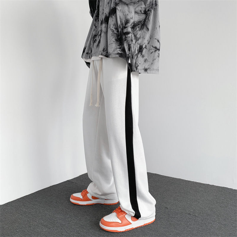 Férfi sportos nadrág, lazán bő szabású, középső derék, poliészter anyag, kopásálló, 2025 tavasz