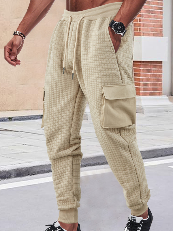 Férfiak szabadidő-munkanadrág, lazán szabott fazon, jacquard apró négyzetek mintázattal, rugalmas poliészter anyag, több zsebbel