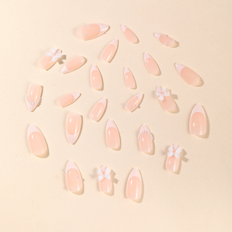 Mandulavágású francia stílusú köröm matrica, gyöngyös és masnis minta nőknek