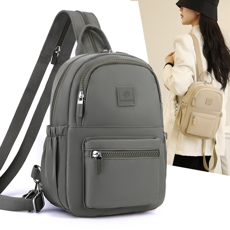 Γυναικεία νάιλον τσάντα πλάτης — αστικός μινιμαλισμός, άνοιγμα με φερμουάρ, εσωτερική θήκη με φερμουάρ, θήκες για κινητό και ταυτότητα, αναπνεύσιμη