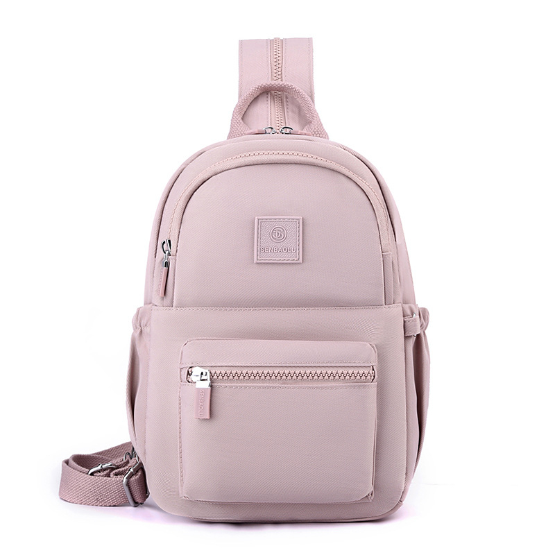 Γυναικεία νάιλον τσάντα πλάτης — αστικός μινιμαλισμός, άνοιγμα με φερμουάρ, εσωτερική θήκη με φερμουάρ, θήκες για κινητό και ταυτότητα, αναπνεύσιμη