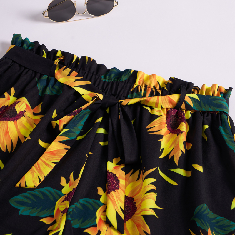 Naiste lahtise lõikega lühikesed püksid elastse vööga, 95% polüester, päevalill-Hawai'i puhkusstiil