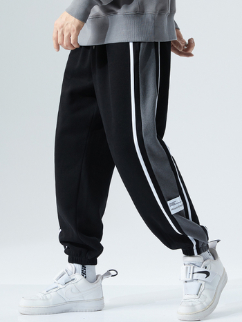 Sportnadrág fleece béléssel, lazán szabott, középmagas derékkal, poliészter 96% / spandex 4%