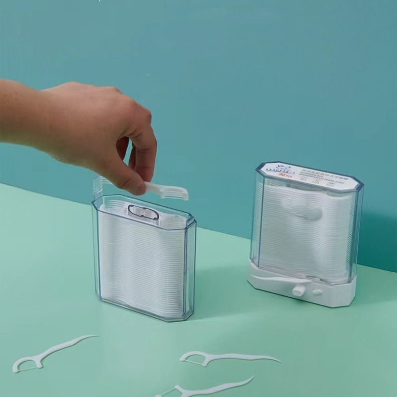 Automātiska zobu diegu kastīte ar 120 vienreizējām izliektām zobu diegu kociņām pieaugušajiem