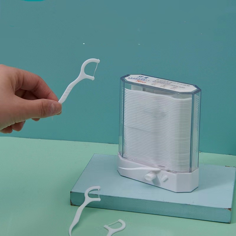 Automātiska zobu diegu kastīte ar 120 vienreizējām izliektām zobu diegu kociņām pieaugušajiem