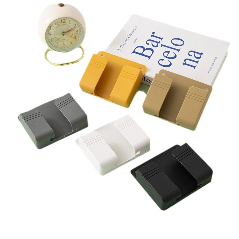 Fali szerelhető töltő- és tárolóalap telefonhoz és távirányítóhoz