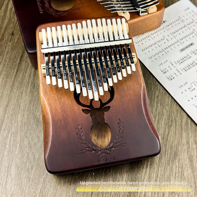 Drevená kalimba (prstové klavíro), 17 alebo 21 tónov, 21 otvorov, jadro z broskyňového dreva, tónina C