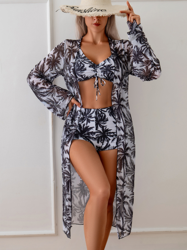 Moterų trijų dalių maudymosi kostiumėlis su kokosų raštu ir tinkliniu UV apsaugos dangteliu; viršus su petnešėlėmis, bikini viršus ir tinklinis gaubtas; krūties įdėklai, be plieno atramos; medžiaga poliesteris 82%, svoris 195 g; pamušalas 100% poliesteris.