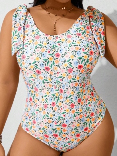 Egyrészes fürdőruha törött virágmintával, ujj nélküli, melltartóbetéttel, merevítők nélkül, 82% poliészter / 18% elasztán