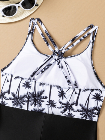 Ολόσωμο μαγιό με φλοράλ μοτίβο, ανοιχτή πλάτη, χωρίς τιράντες, με επενδεδυμένο σουτιέν χωρίς μπανέ, ύφασμα πολυεστέρα 82/18, επένδυση 95/5, κατάλληλο για κολύμβηση και θαλάσσια σπορ.