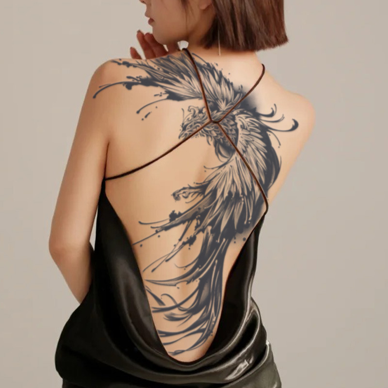 Phoenix pilnīga muguras tetovējuma uzlīme — gan vīriešiem, gan sievietēm; tradicionālais tinti dizains, ūdens pārneses druka, pielāgojama, licencēta privātā zīmola etiķete (Materiāls: Balta kartiņa; Process: Ūdens pārneses druka; Pielāgošana: Jā; Privātā z