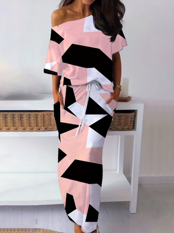 Divu daļu komplekts: geometriski drukāts T-krekls un svārki, Milk Silk audums; slaids piegriezums; plecu atklātais izgriezums; 3/4 piedurknes; poliesters 90-95% un spandeks <30%