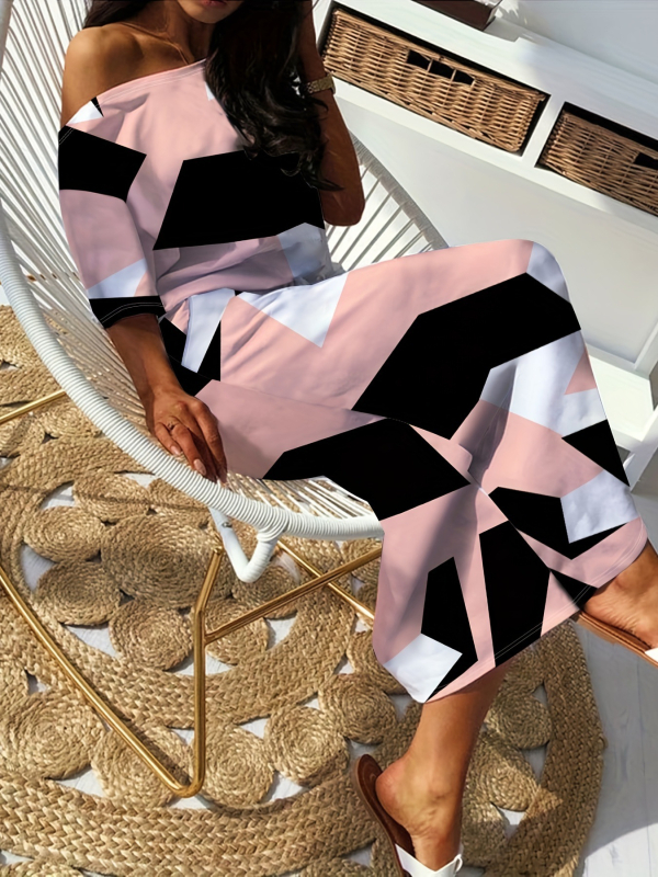 Dviejų dalių komplektas: geometriniu spauda marškinėliai ir sijonas, Milk Silk audinys; siauras kirpimas; pečių atskleidimo iškirptė; 3/4 rankovės; poliesteris 90-95%, spandeksas <30%