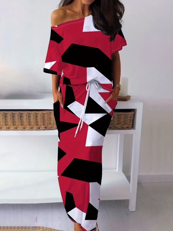 Dviejų dalių komplektas: geometriniu spauda marškinėliai ir sijonas, Milk Silk audinys; siauras kirpimas; pečių atskleidimo iškirptė; 3/4 rankovės; poliesteris 90-95%, spandeksas <30%