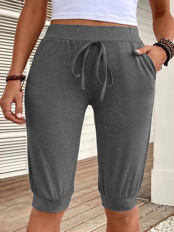 Žene capri jog hlače ravnog kroja s džepovima, Milk Silk tkanina, poliester 90–95% i spandeks 5–10%, srednji pojas, mikroelastičnost