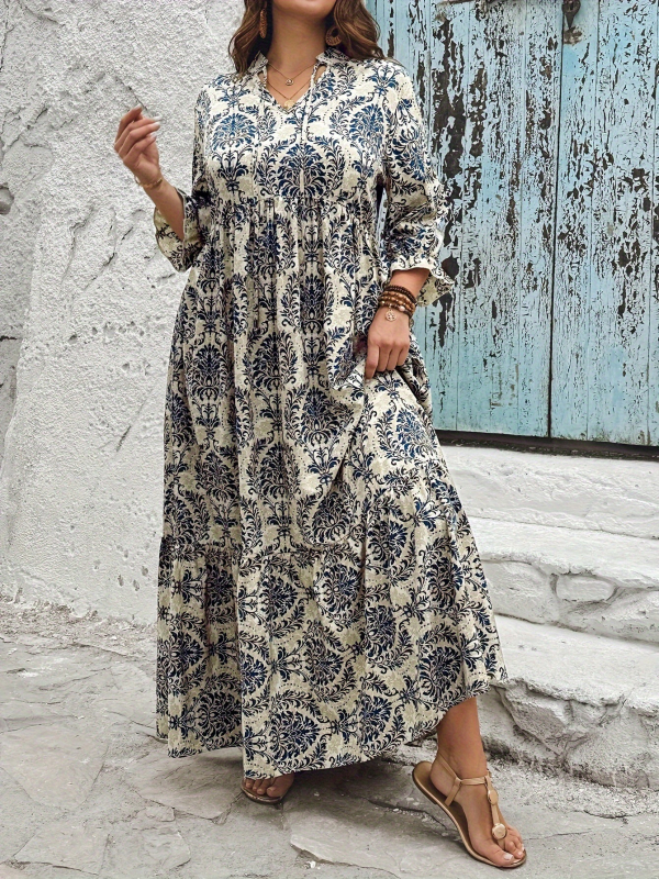 Otisnuta haljina s V-izrezom, široka njišuća suknja, puff rukavima do tri četvrtine, poliester