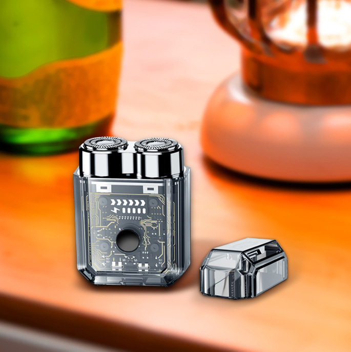 Ηλεκτρική ξυριστική μηχανή με μίνι διαφανή διπλή κεφαλή και μαγνητικό σχεδιασμό — χωρίς ψήκτρες κινητήρας, ενσωματωμένη μπαταρία 300–500 mAh, αυτονομία 60 λεπτών, κεφαλή περιστροφής με δύο λεπίδες, πλήρες πλύσιμο σώματος