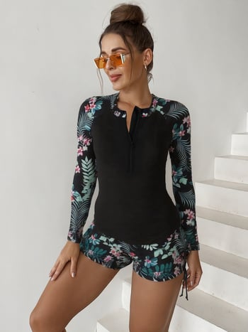 Costum de baie cu imprimeu floral, mâneci lungi, pernă pentru bust și protecție solară; material principal 82% poliester, căptușeală 18% spandex.