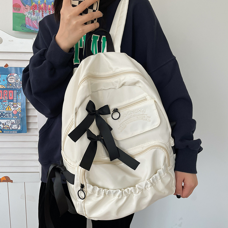 Női nylon hátizsák, 20–35 L, vízálló, bővítési funkcióval és ívelt vállpánttal, mindennapi használatra