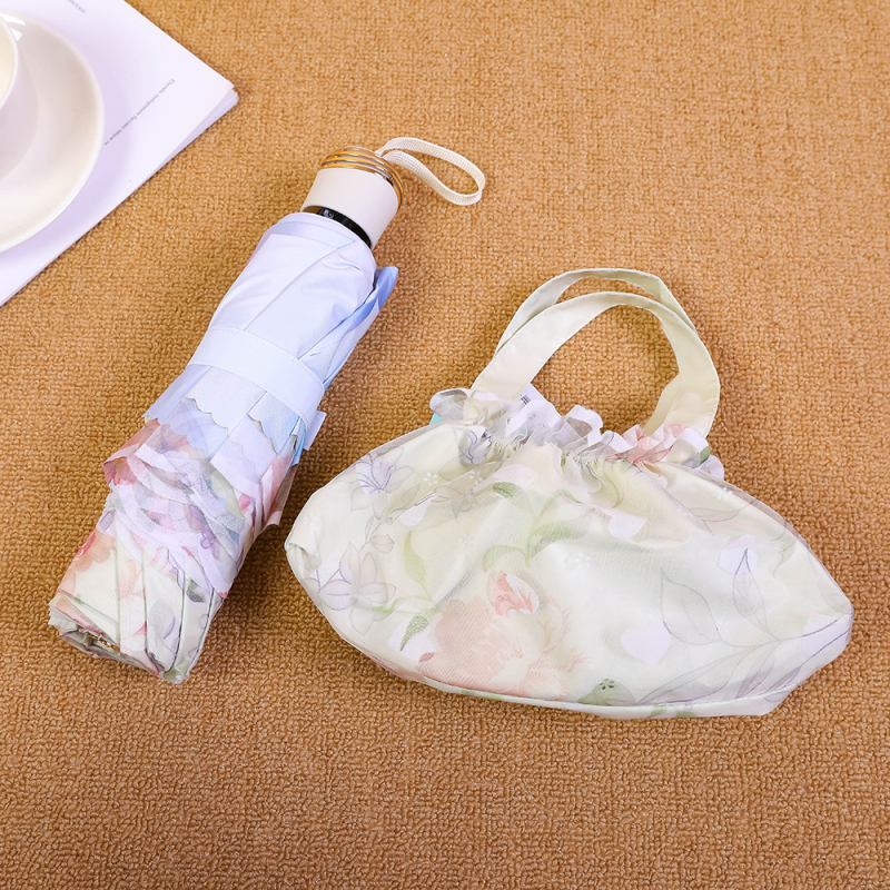 Mežģīņu audums, dubultslāņu lietussargs, 8 stieņu dzelzs rāmis, manuāla atvēršana, silikona rokturis, UV PA++ aizsardzība