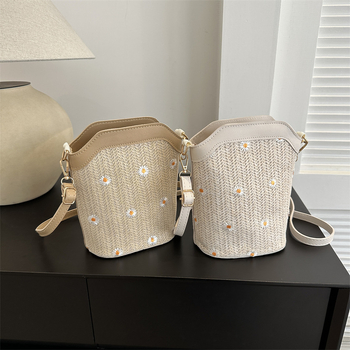 Bucket bag with rope braid material, zipper opening, bucket silhouette, internal cellphone pocket, inner patch pocket