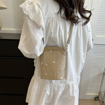 Bucket bag with rope braid material, zipper opening, bucket silhouette, internal cellphone pocket, inner patch pocket