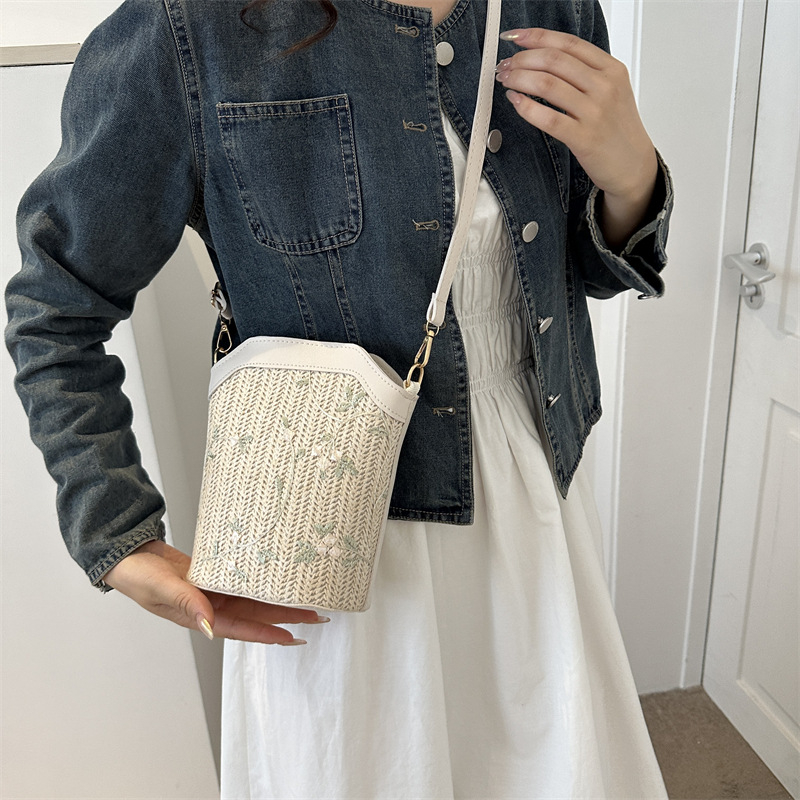 Bucket bag with rope braid material, zipper opening, bucket silhouette, internal cellphone pocket, inner patch pocket